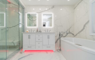 bathroom renovation with light underneath cabinet